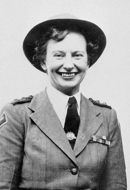 Shows a smiling woman (Vivian Bullwinkel) wearing a military looking uniform.
