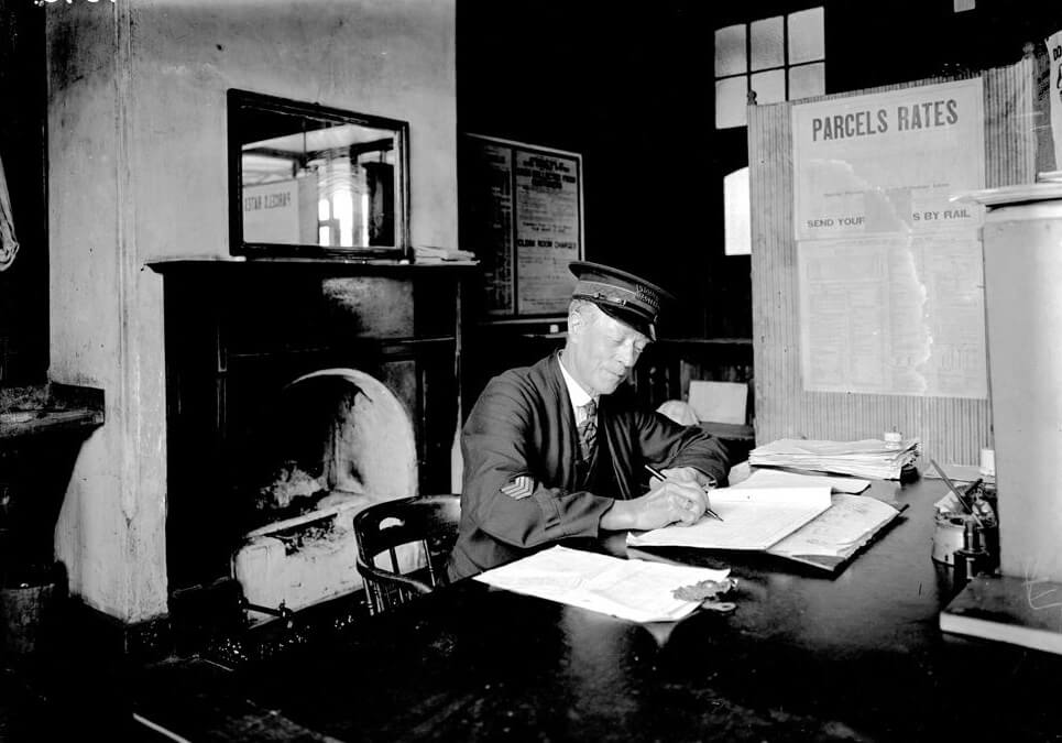 MACEDON STATION MASTER AT WORK IN HIS OFFICE. c1928