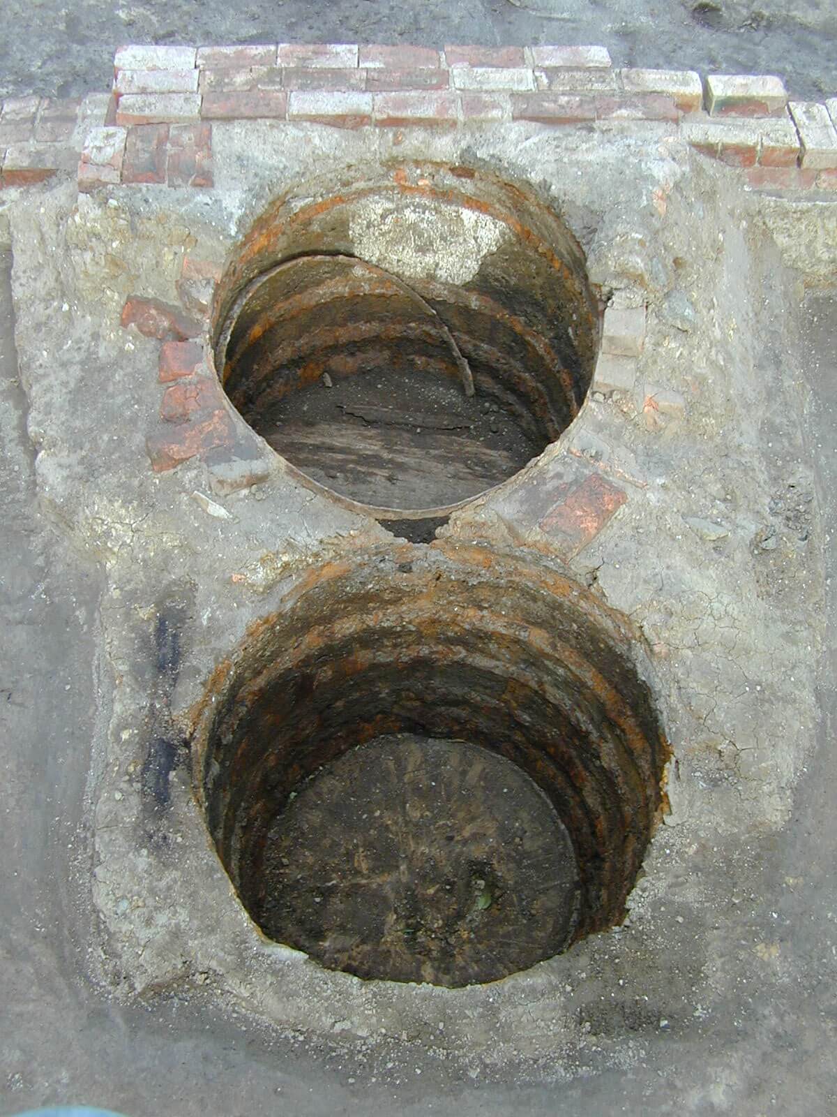 Dual cesspit. Two holes in a brick ground. they are clean, but old and have seen use quite some time ago.